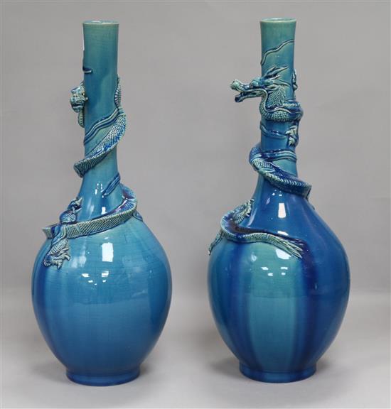 A pair of turquoise Oriental dragon vases
